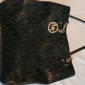 Michael Kors Black Patent purse with gold chain straps.